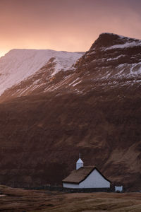 Scenic view of snowcapped mountains against sky during sunset