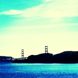 Calm blue sea with buildings in background