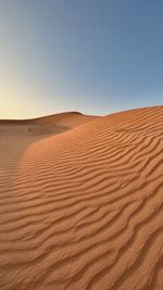 Scenic view of desert against clear sky