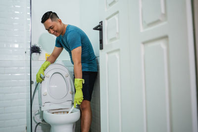 Side view of man working at home