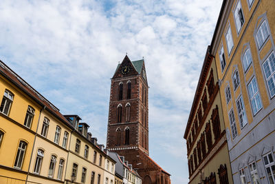 Low angle view of buildings against sky in city