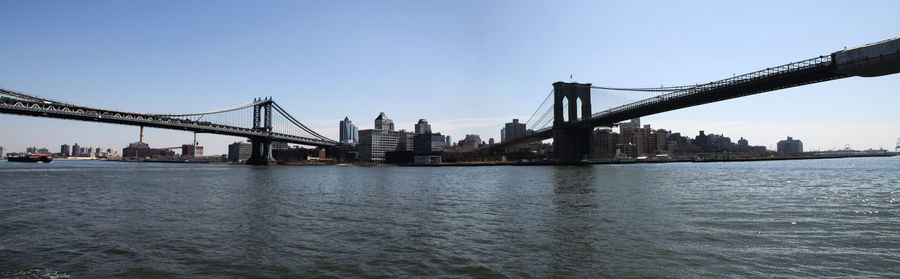 View of suspension bridge with city in background