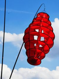 Low angle view of red lantern against sky