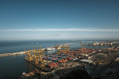 High angle view of docks by sea against sky