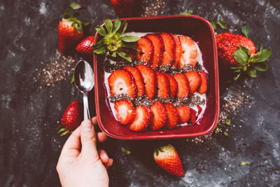 Directly above shot of person holding strawberries