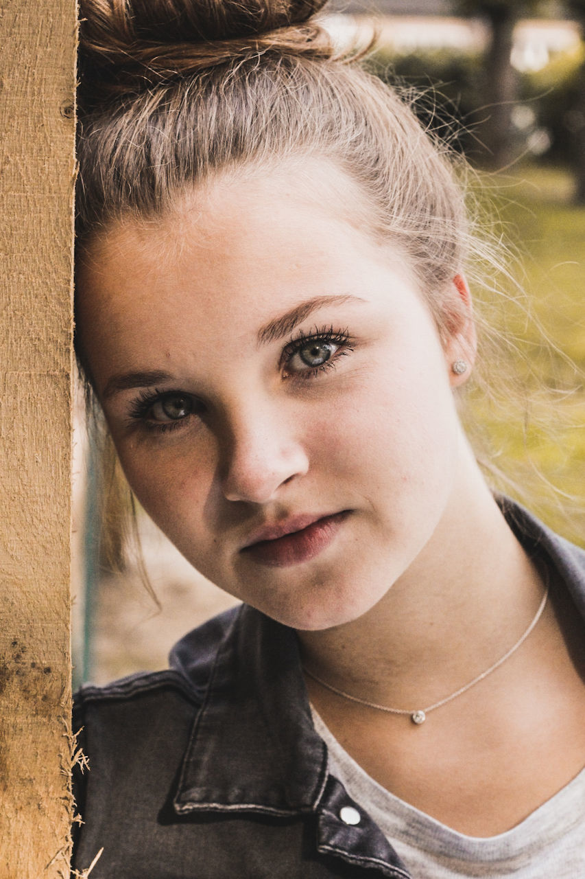 CLOSE-UP PORTRAIT OF BEAUTIFUL WOMAN