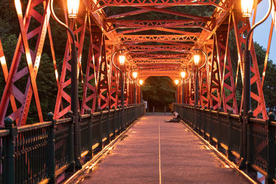 Illuminated footbridge at night