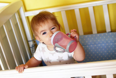 High angle view of cute baby girl at home