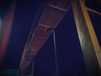 Low angle view of bridge against sky at night