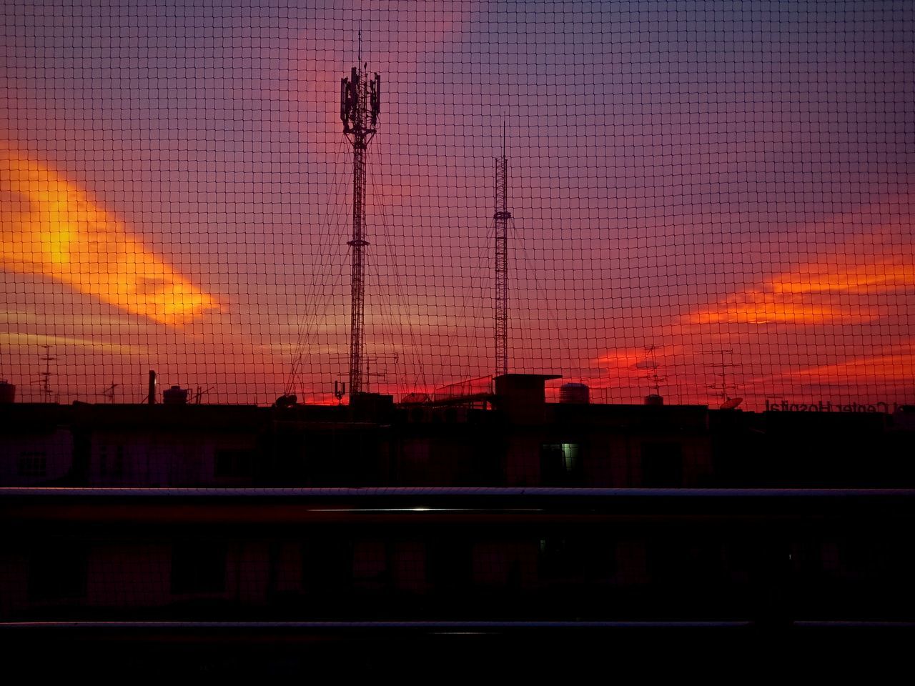 SILHOUETTE CITY AGAINST SKY DURING SUNSET