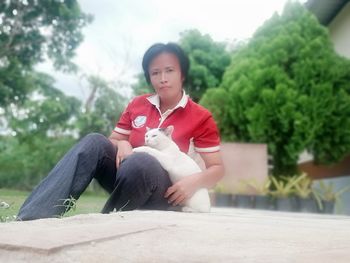 Portrait of boy sitting outdoors