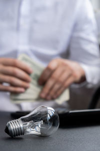 Midsection of man working at table