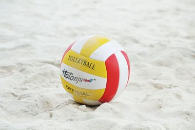 Close-up of ball on sand at beach