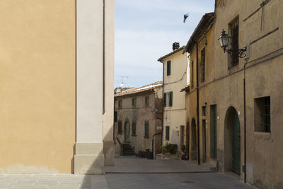 Narrow street amidst buildings in town