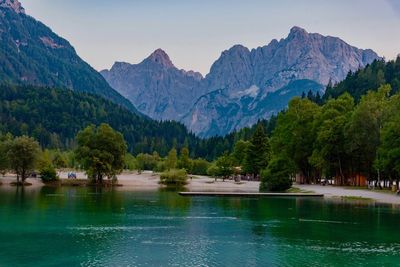 Scenic view of lake and mountains against sky