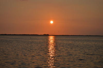 Scenic view of sea at sunset