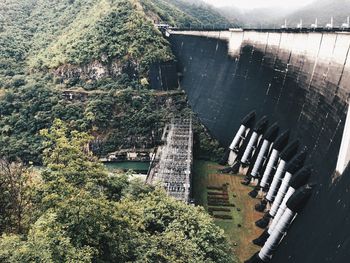 High angle view of dam amidst trees