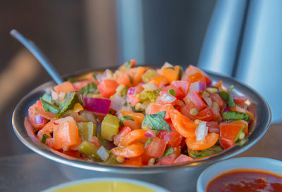 Close-up of chopped fruits in bowl on table