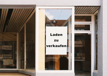 Text on glass door of building