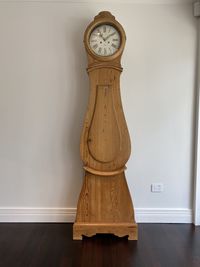 Close-up of clock on table at home