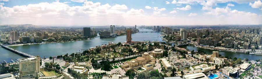 High angle view of city buildings by river