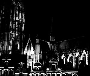 Panoramic shot of illuminated buildings in city at night