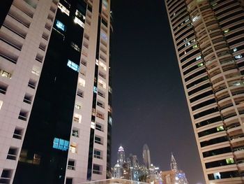 Low angle view of illuminated city at night