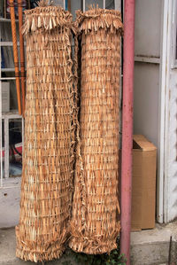 Stack of wicker basket hanging from wall