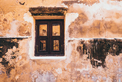 Low angle view of window on old building