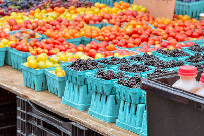 Blackberry and cherry tomato unfocused. organic local food street market. nyc. usa.