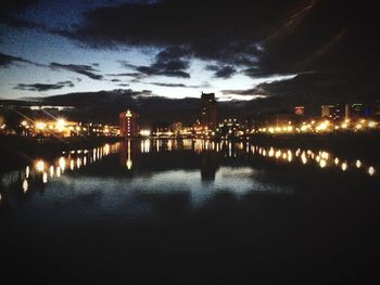 Reflection of illuminated buildings in water