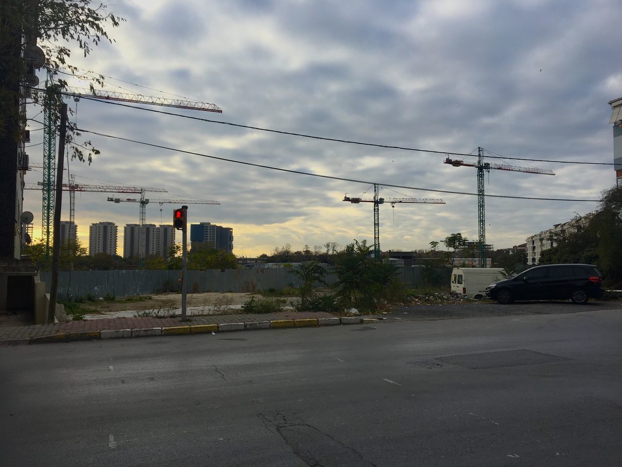 VIEW OF STREET AGAINST CLOUDY SKY