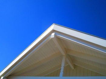 Low angle view of building against clear blue sky