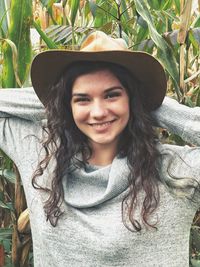 Portrait of smiling young woman wearing hat