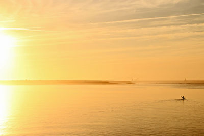 Scenic view of sea against sky at sunset