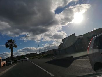Cars on road against sky