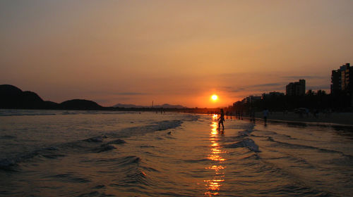 View of beach at sunset