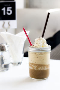 Close-up of ice cream in glass on table