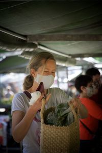 Woman holding food in market