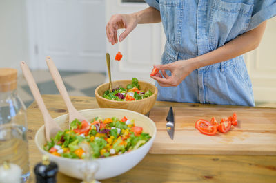 Midsection of man preparing food on table