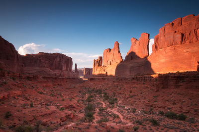 Rock formations on landscape against sky