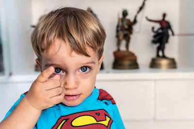 Close-up portrait of boy at home