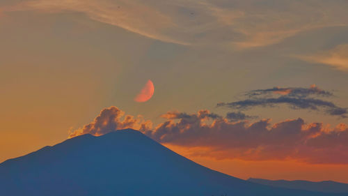 Low angle view of dramatic sky during sunset