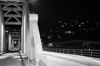 Illuminated bridge at night