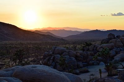 Scenic view of mountains against sky during sunset