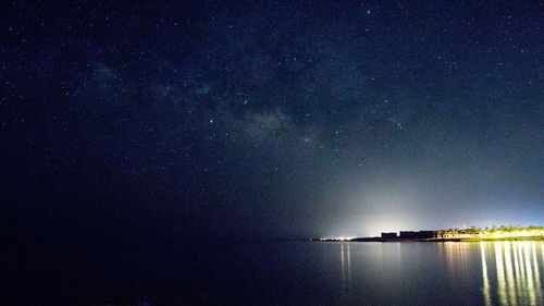 Scenic view of sea against sky at night