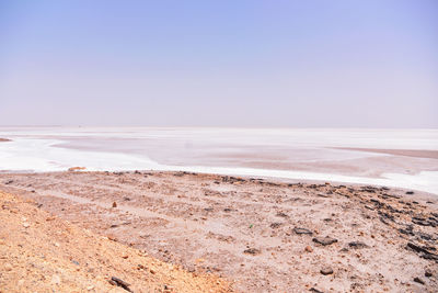 Scenic view of beach against clear sky