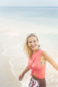 Woman enjoying at beach during summer