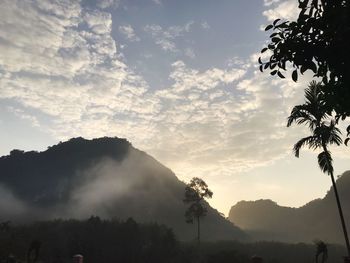 Scenic view of silhouette mountains against sky during sunset