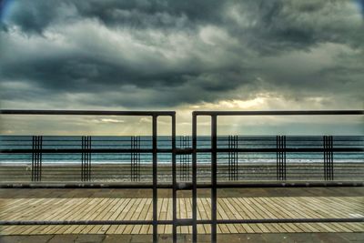 Scenic view of sea against storm clouds